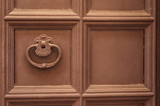 Old metal knocker on a door