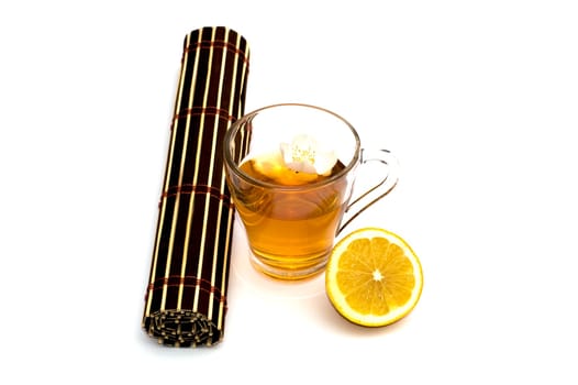 glass of yellow drink, treatment by herbs, a still life on a subject drinks