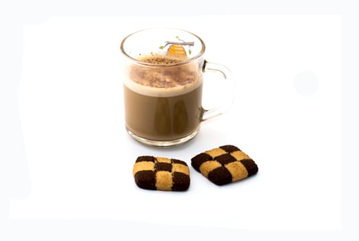 the transparent mug about a cappuccino and two checkered cookies, a subject drinks on a white background