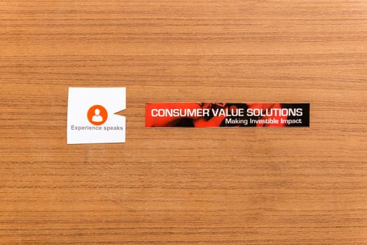 experience speaks sticker on the wooden background