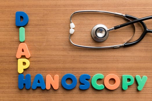 diaphanoscopy colorful medical word and stethoscope on the wooden background
