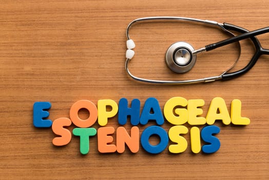 esophageal stenosis colorful medical word and stethoscope on the wooden background