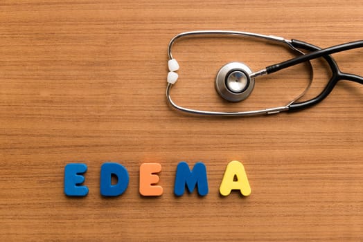 edema colorful medical word and stethoscope on the wooden background