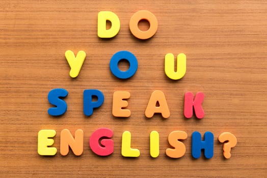 do you speak english colorful words on the wooden background