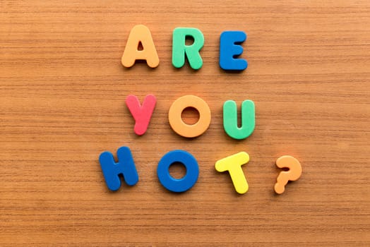 are you hot colorful words on the wooden background