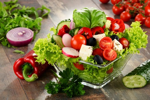Vegetable salad bowl on kitchen table. Balanced diet.