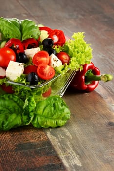 Vegetable salad bowl on kitchen table. Balanced diet.