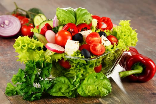 Vegetable salad bowl on kitchen table. Balanced diet.