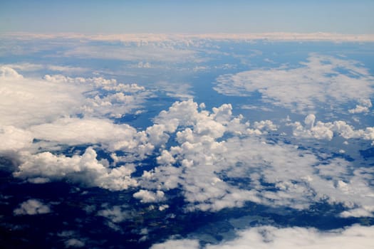above clouds lights and blue sky in plane