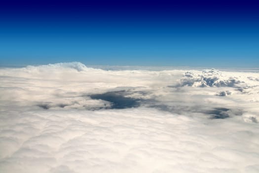 above clouds lights and blue sky in plane