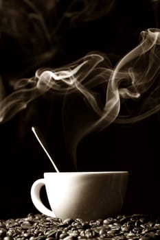 coffee beans and white hot cup of drink