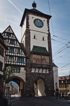 Vertical shot of the Schwabentor, a medieval city gate, in Freiburg, Germany