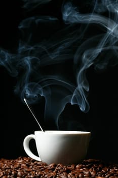 coffee beans and white hot cup of drink