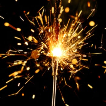 christmas sparkler firework flame on black