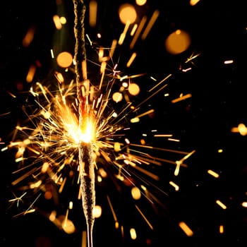 christmas sparkler firework flame on black
