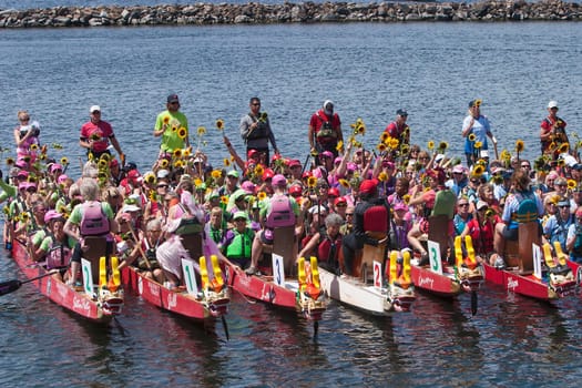 Dragon boat races on Lake Champlain in Burlington, Vermont, USA.  The races are held to raise money for breast cancer survivors.