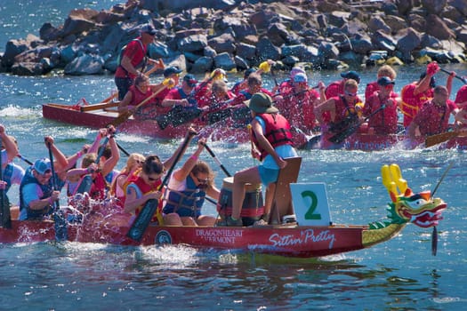 Dragon boat races on Lake Champlain in Burlington, Vermont, USA.  The races are held to raise money for breast cancer survivors.