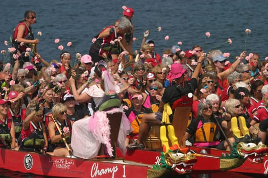 Dragon boat races on Lake Champlain in Burlington, Vermont, USA.  The races are held to raise money for breast cancer survivors.
