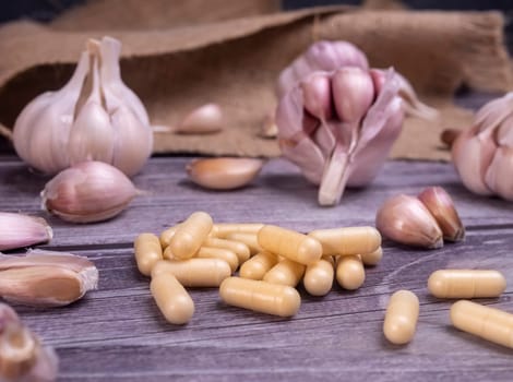 Garlic capsule supplements for immune system health. Garlic contains antioxidants with beneficial health effects, reduce blood pressure, help protect against illness.