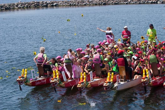 Flower Ceremony at Dragon Boat races.  Tkhe flowers represent a brest cancer patient that didn't survive.  on Lake Champlain Burlington, Vermont.
