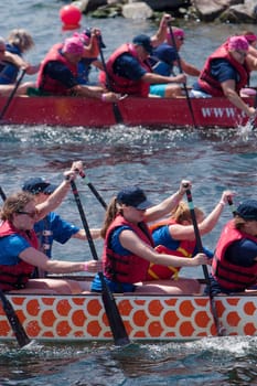 Dragon boat races on Lake Champlain in Burlington, Vermont, USA.  The races are held to raise money for breast cancer survivors.