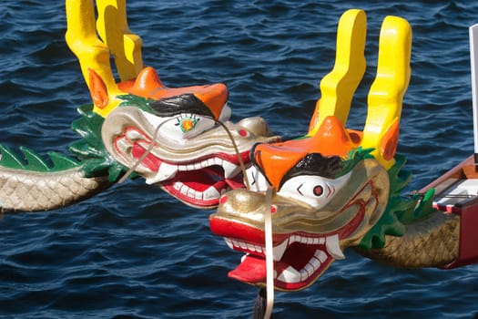 Dragon heads on dragon boats on Lake Champlain.  Dragon boats are used in races world wide to raise money for breast cancer survivors.