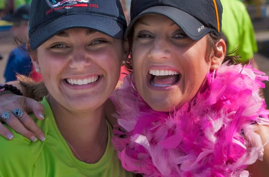 Two Dragon boat racers united before a race on Lake Champlain in Burlington, Vermont, USA.  The races are held to raise money for breast cancer survivors.