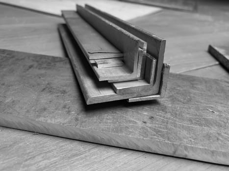 aluminum blanks, cut to size on a workbench in a workshop