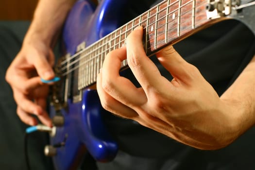 man play solo on blue guitar