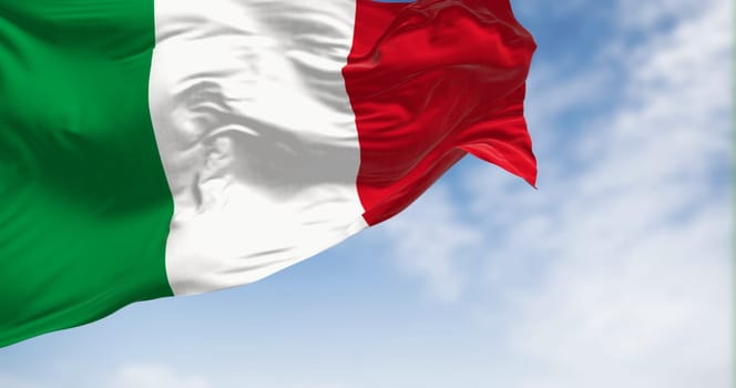 Italy national flag waving in the wind on a clear day. Three vertical bands of green, white and red. 3d illustration render. Rippled textile