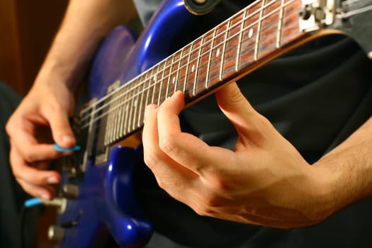 man play solo on blue guitar