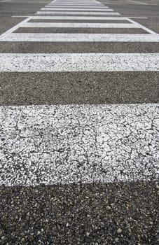 Detail of signal for pedestrians on the asphalt, pedestrian crossing on a road