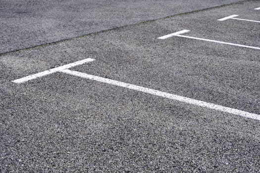 Detail of parking lines in a public parking lot, road signs
