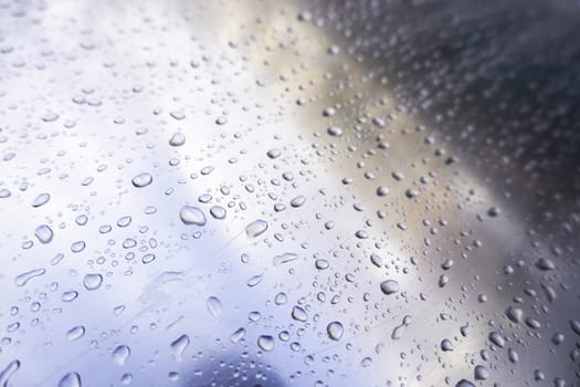 Detail of stainless steel surface wet from the rain