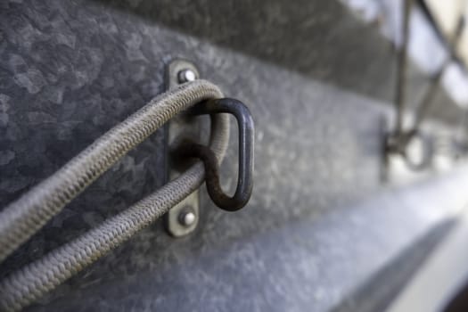 Fastening detail of an old canvas of a transport truck