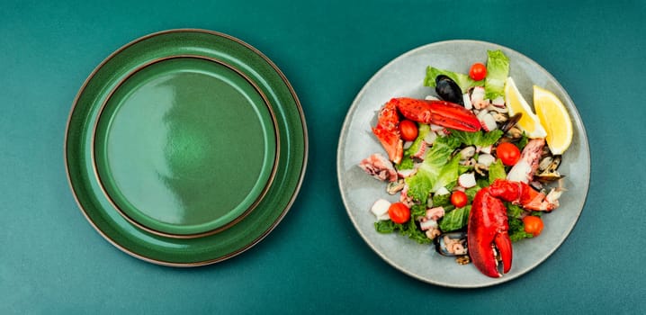 Appetizing salad of oysters, mussels, lobster and vegetables.