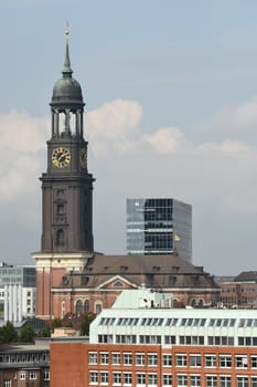 Vertical view of St. Michael's Church bell tower under the blue sky in Hamburg, Germany