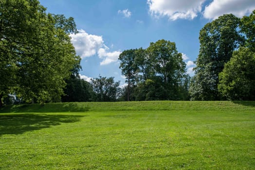 An exterior side view of the the Great Circle at the Native American Newark Earthworks built by prehistoric indigenous people in Ohio. Green grass, sunny outdoors with no people and copy space.