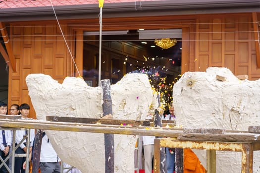 Nonthaburi, Thailand - AUG 17, 2019 - Pouring ceremony for Thonglor Buddha statues at Samian Nari Temple at Chatuchak, Bangkok, Thailand.
