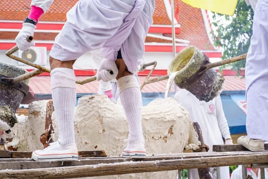 Nonthaburi, Thailand - AUG 17, 2019 - Pouring ceremony for Thonglor Buddha statues at Samian Nari Temple at Chatuchak, Bangkok, Thailand.
