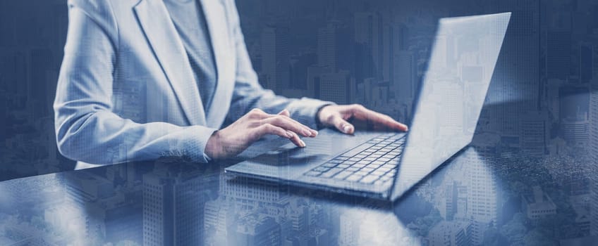 Woman with her laptop in the office and working. Concept of the global business.