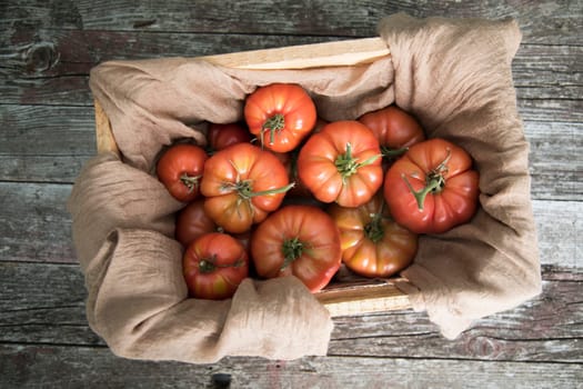 Vegetables, tomatoes on wooden desk