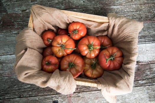 Vegetables, tomatoes on wooden desk