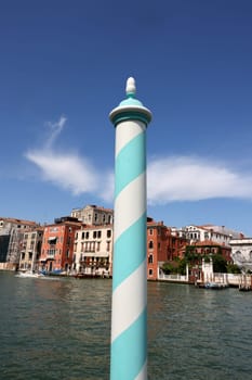 Venice, Italy - September 5, 2022: Wooden mooring pole at Canal Grande in Venice. Italy