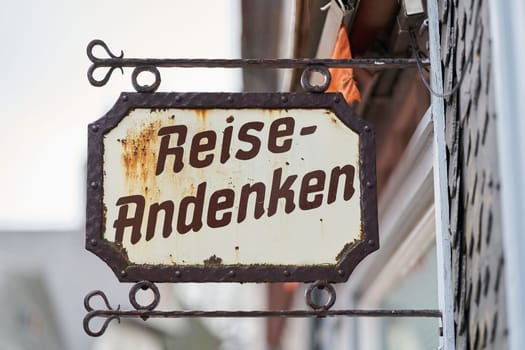 Sign on a store in the old town of Goslar with the German inscription Reiseandenken. Translation: Travel souvenir