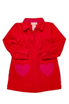 Summer dress isolated. A beautiful red girl's dress with attached heart shaped pockets and long sleeves isolated on white. Kids spring and autumn fashion.