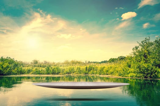 Futuristic metal stage hovering over a idyllic lake