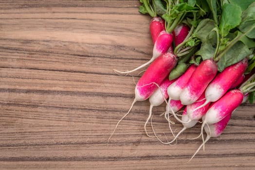 Radishes on a dark wooden table