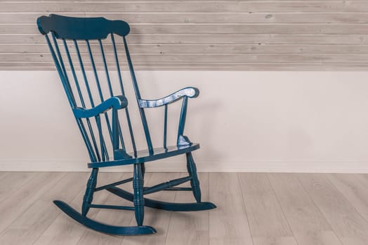 Blue rocking chair in a living room