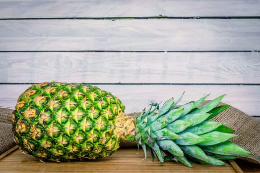Eco pineapple on a wooden table with linen